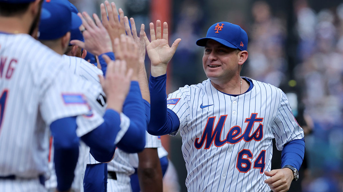 New York Mets manager Carlos Mendoza (64) is introduced before the Mets home opener against the Toronto Blue Jays at Citi Field.