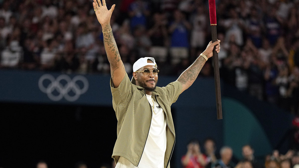 Carmelo Anthony performs before a men’s basketball quarterfinal game between the United States and Brazil during the Paris 2024 Olympic Summer Games at Accor Arena.
