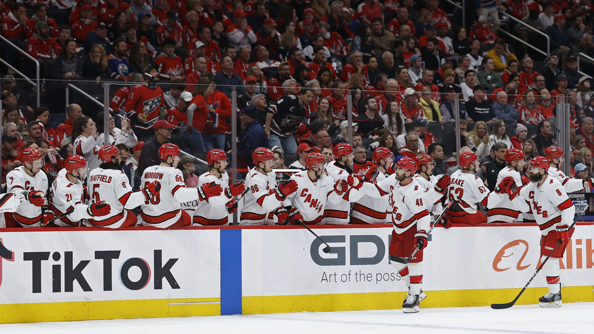 Carolina Hurricanes left wing Jordan Martinook (48) celebrates with teammates after scoring a goal against the Washington Capitals in the third period at Capital One Arena.