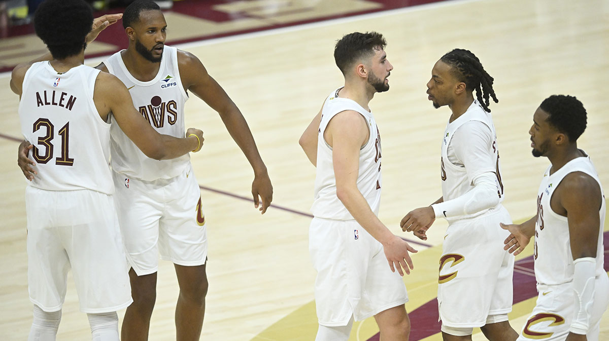 The Cleveland Cavaliers gather near center court in the fourth quarter during a win over the Miami Heat at Rocket Arena.