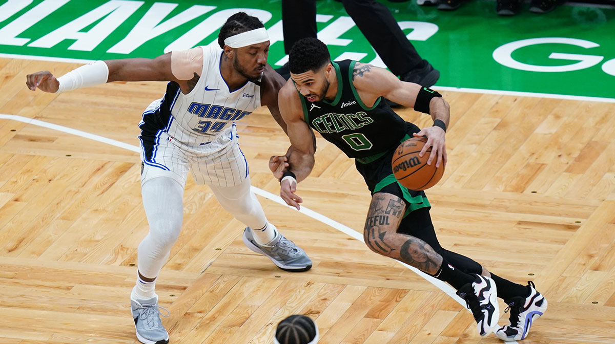Celtics forward Jayson Tatum (0) drives the ball against Orlando Magic center Wendell Carter Jr. (34) in the first quarter during game five of first round for the 2025 NBA Playoffs at TD Garden