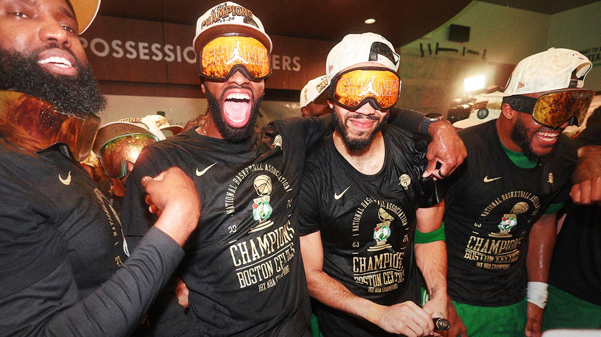 The Boston Celtics celebrate in the locker room after winning the 2024 NBA Finals against the Dallas Mavericks at TD Garden.