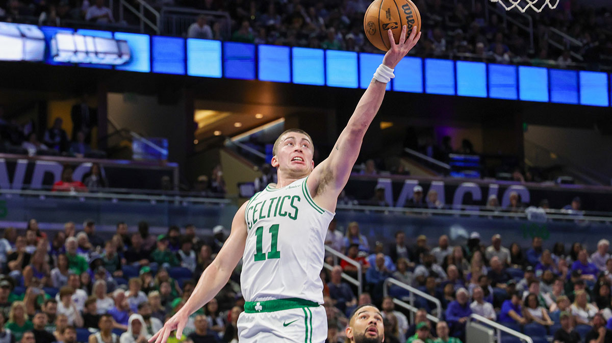 Boston Celtics guard Payton Pritchard (11) goes to the basket in front of Orlando Magic guard Cory Joseph (10) during the second quarter at Kia Center.