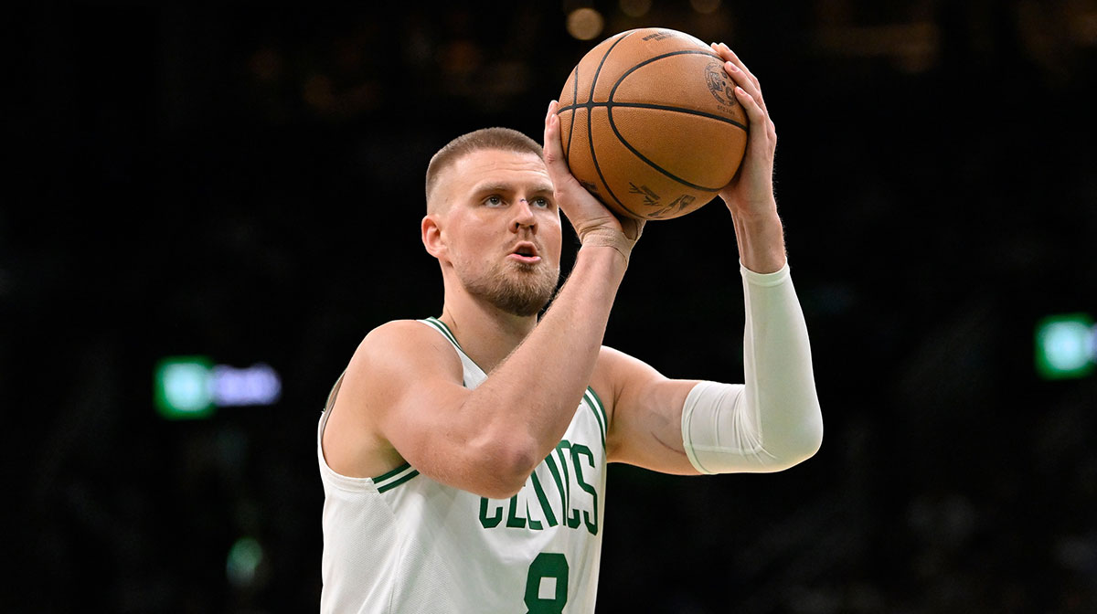 Boston Celtics center Kristaps Porzingis (8) shoots a free throw during the first half against the Charlotte Hornets at TD Garden.