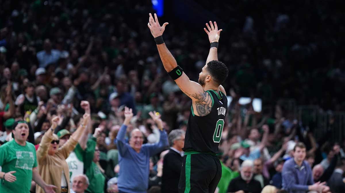 Celtics forward Jayson Tatum (0) reacts after a three point basket