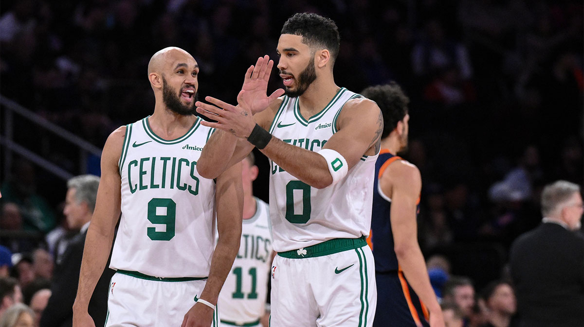 Boston Celtics forward Jayson Tatum (0) and Boston Celtics guard Derrick White (9) react during the first half against the New York Knicks at Madison Square Garden.