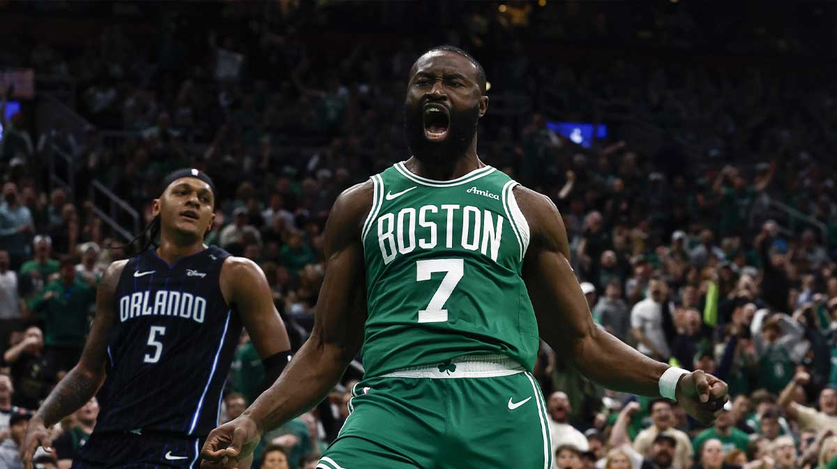 Celtics guard Jaylen Brown (7) shouts out after dunking