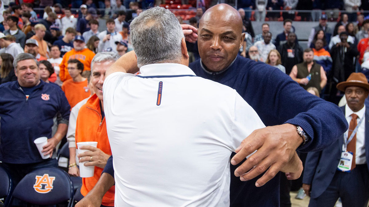 Auburn Tigers head coach Bruce Pearl hugs former Auburn basketball player Charles Barkley as Auburn Tigers take on USC Trojans at Neville Arena
