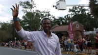 FSU alumni and 2018 homecoming parade grand marshal Charlie Ward waves