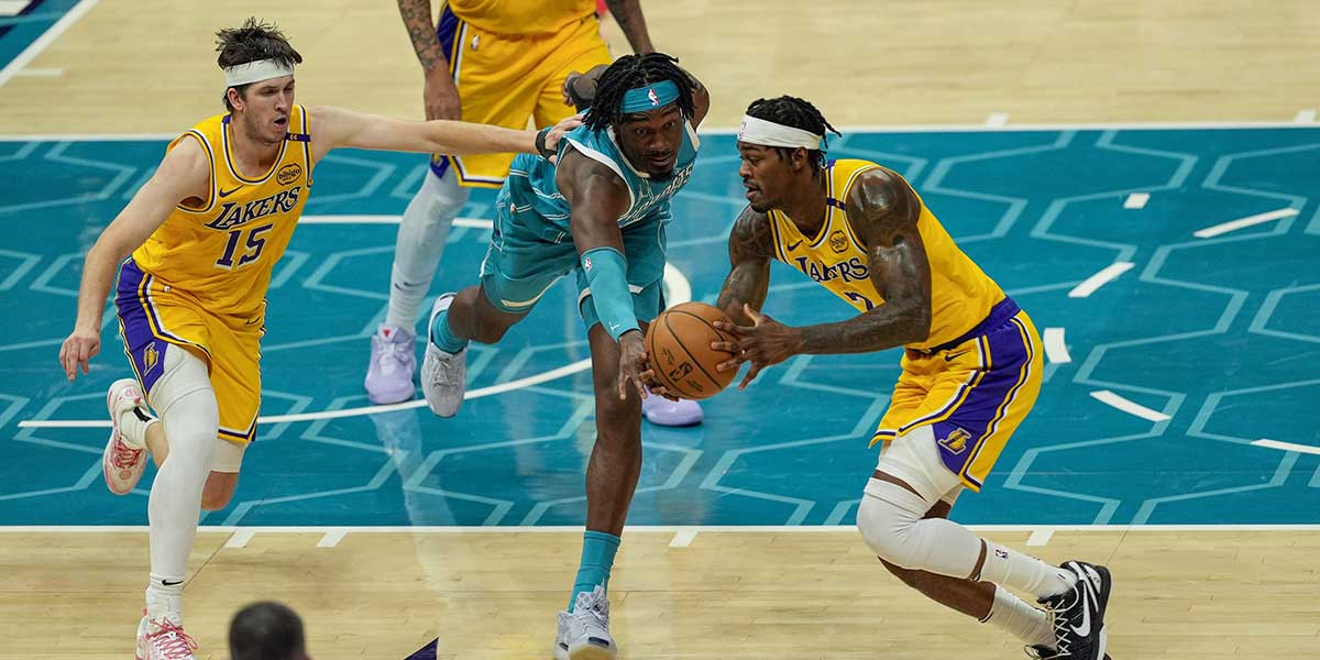Charlotte Hornets center Mark Williams (5) tries for a steal from Los Angeles Lakers forward Jarred Vanderbilt (2) during the second half at the Spectrum Center.