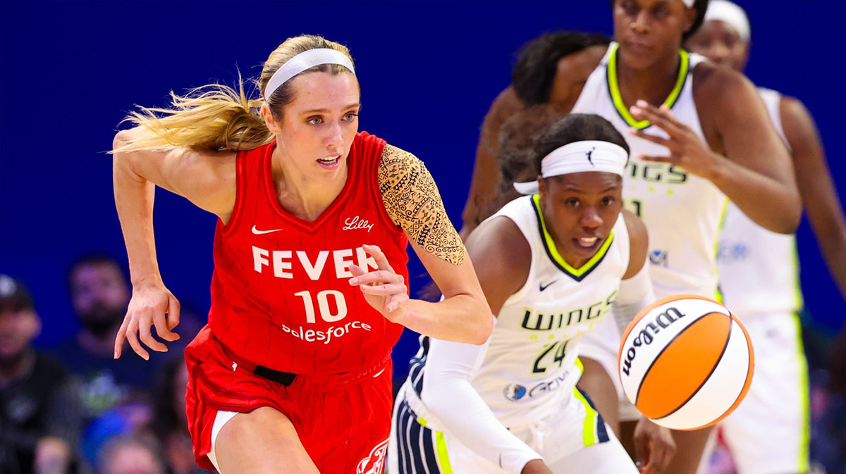 Indiana Fever guard Lexie Hull (10) and Dallas Wings guard Arike Ogunbowale (24) go for the ball during the second half at College Park Center.