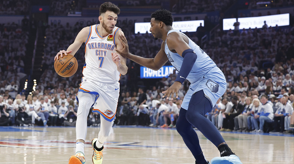 Oklahoma City Thunder forward Chet Holmgren (7) drives to the basket as Memphis Grizzlies forward Jaren Jackson Jr. (13) defends during the first quarter at Paycom Center.