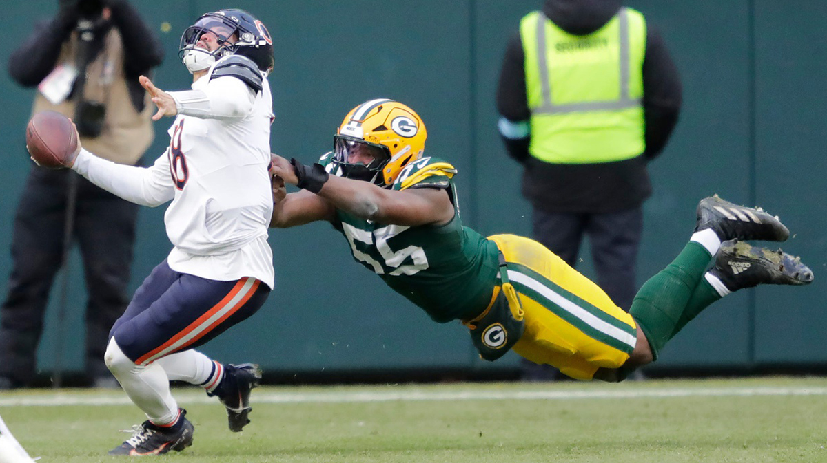 Green Bay Packers defensive end Kingsley Enagbare (55) horse collars Chicago Bears quarterback Caleb Williams (18) in the fourth quarter during their football game Sunday, January 5, 2025, at Lambeau Field in Green Bay, Wisconsin.