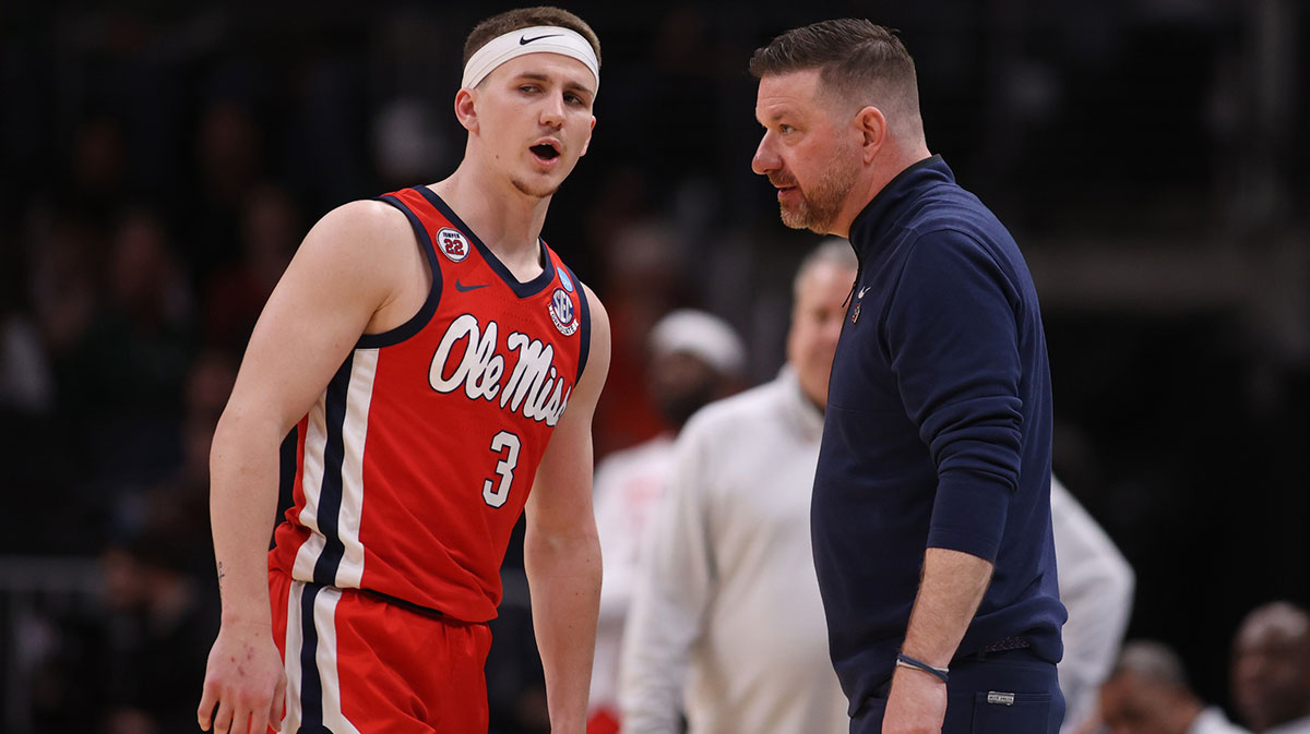 Mississippi Rebels guard Sean Pedulla (3) talks to head coach Chris Beard in the first half of a South Regional semifinal of the 2025 NCAA tournament against the Michigan State Spartans at State Farm Arena.