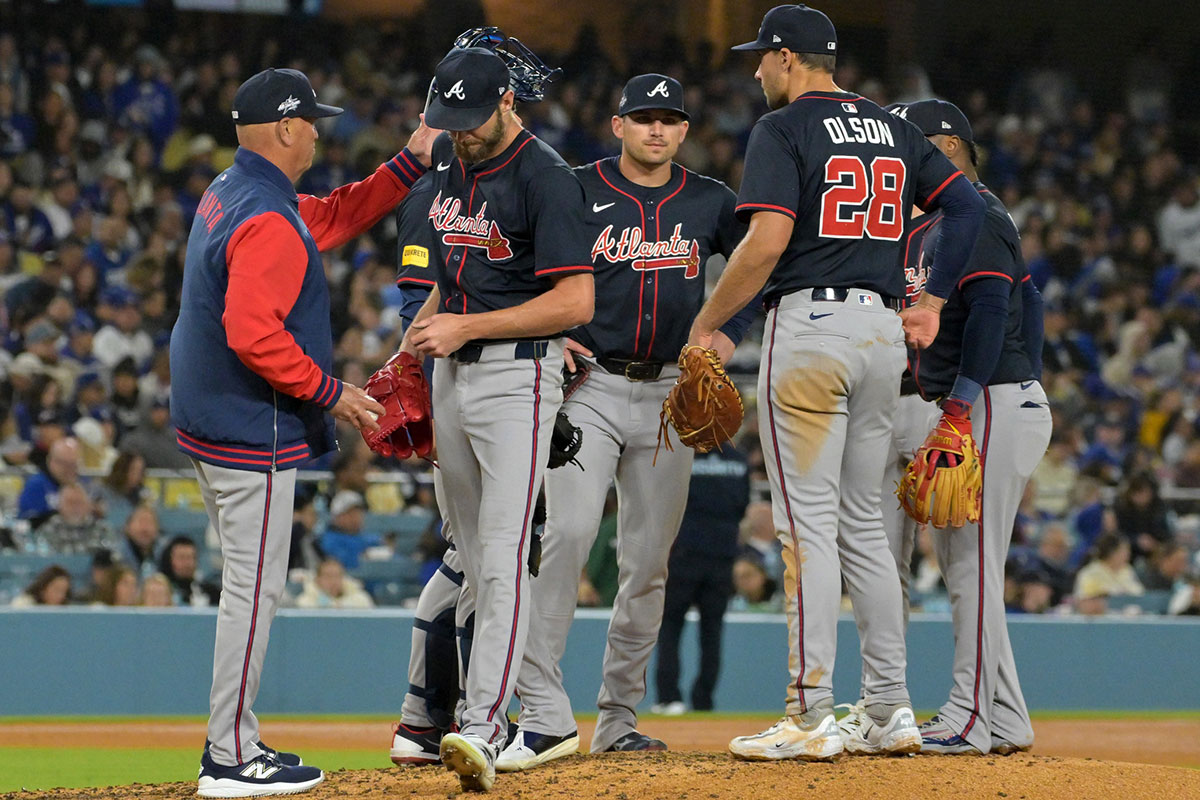Atlanta Braves manager Brian Snitker (43) pulls starting pitcher Chris Sale (51) in the sixth inning against the Los Angeles Dodgers at Dodger Stadium.