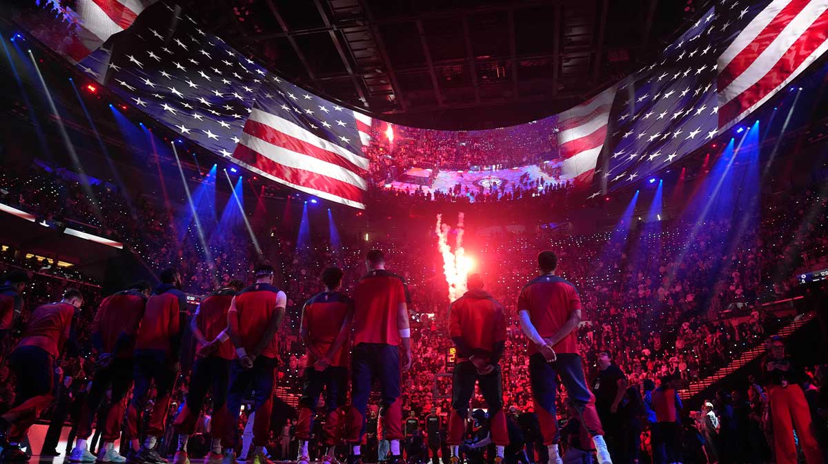 LA Clippers players stand for the National Anthem before a game against the Houston Rockets at the Intuit Dome.