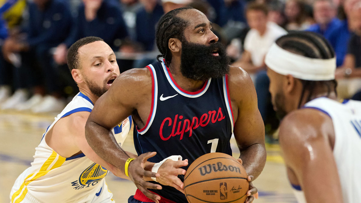 LA Clippers guard James Harden (1) drives to the basket as Golden State Warriors guard Stephen Curry (30) extends for the ball during the third quarter at Chase Center.