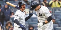 New York Yankees first base Ben Rice (22) celebrates with outfielder Cody Bellinger (35) after hitting a solo home run against the San Francisco Giants during the sixth inning at Yankee Stadium.