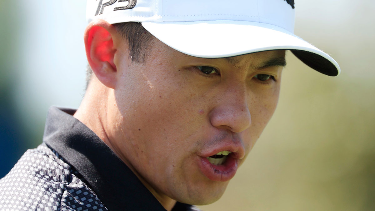 Collin Morikawa talks down the fairway on the first hole during the third round of The Players Championship PGA golf tournment