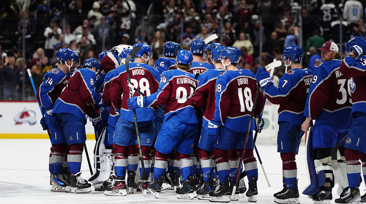 Members of the Colorado Avalanche celebrate a shootout win against the Vegas Golden Knights at Ball Arena.