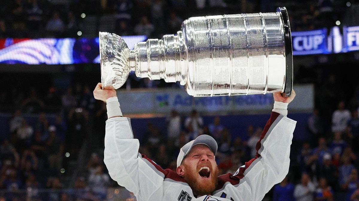 Colorado Avalanche left wing Gabriel Landeskog (92) celebrates with the Stanley Cup after the game against the Tampa Bay Lightning in game six of the 2022 Stanley Cup Final at Amalie Arena.