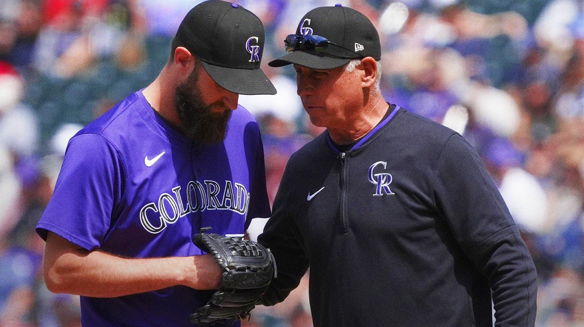 Colorado Rockies manager Bud Black (10) talks to relief pitcher Jake Bird (59) in the sixth inning against the Cincinnati Reds at Coors Field.