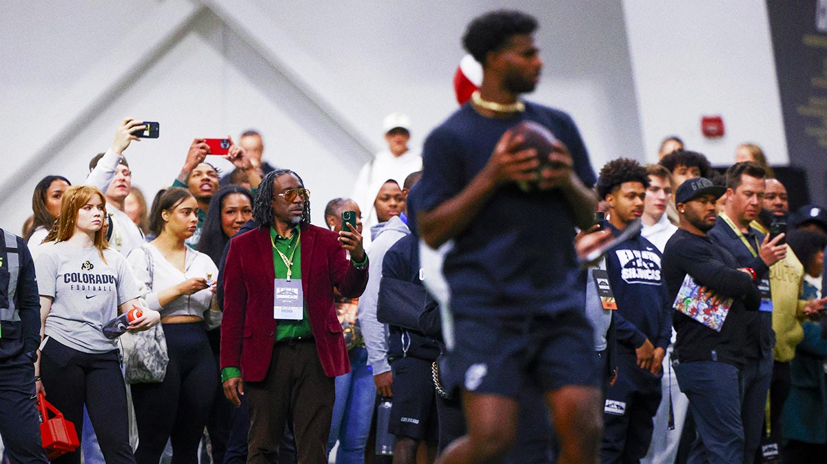 People watch as Colorado Buffaloes quarterback Shedeur Sanders (2) looks to pass the ball at the University of Colorado NFL Showcase at the CU Indoor Practice Facility.