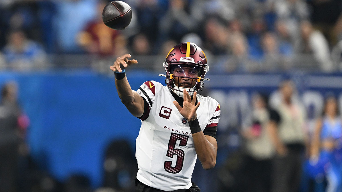 Washington Commanders quarterback Jayden Daniels (5) throws a pass during the first quarter against Detroit Lions in a 2025 NFC divisional round game at Ford Field.