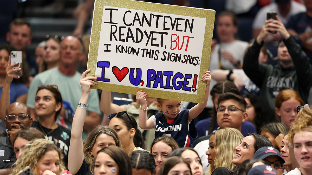 Connecticut Huskies fans hold up Paige Bueckers signs after the national championship of the women's 2025 NCAA tournament against the South Carolina Gamecocks at Amalie Arena.