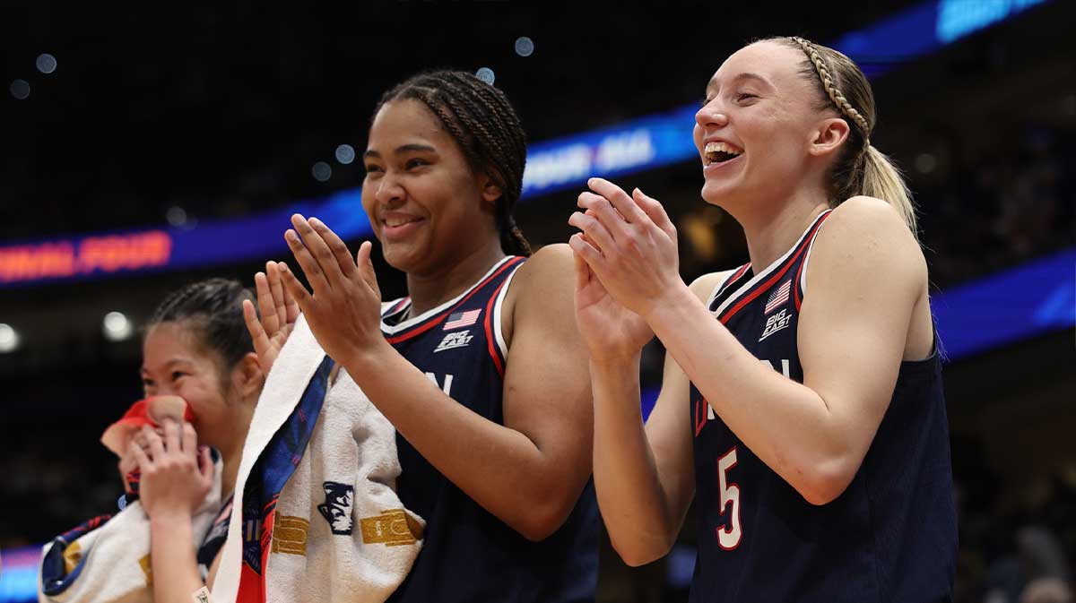 Connecticut Huskies forward Sarah Strong (21) and guard Paige Bueckers (5) react on the bench during the fourth quarter in a semifinal of the women's 2025 NCAA tournament against the UCLA Bruins at Amalie Arena.