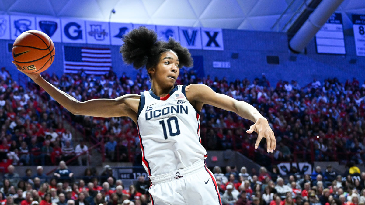 Nov 20, 2024; Storrs, Connecticut, USA; Connecticut Huskies guard Qadence Samuels (10) leaps to keep the ball inbounds during the second half against the Fairleigh Dickinson Knights at Harry A. Gampel Pavilion. Mandatory Credit: Mark Smith-Imagn Images