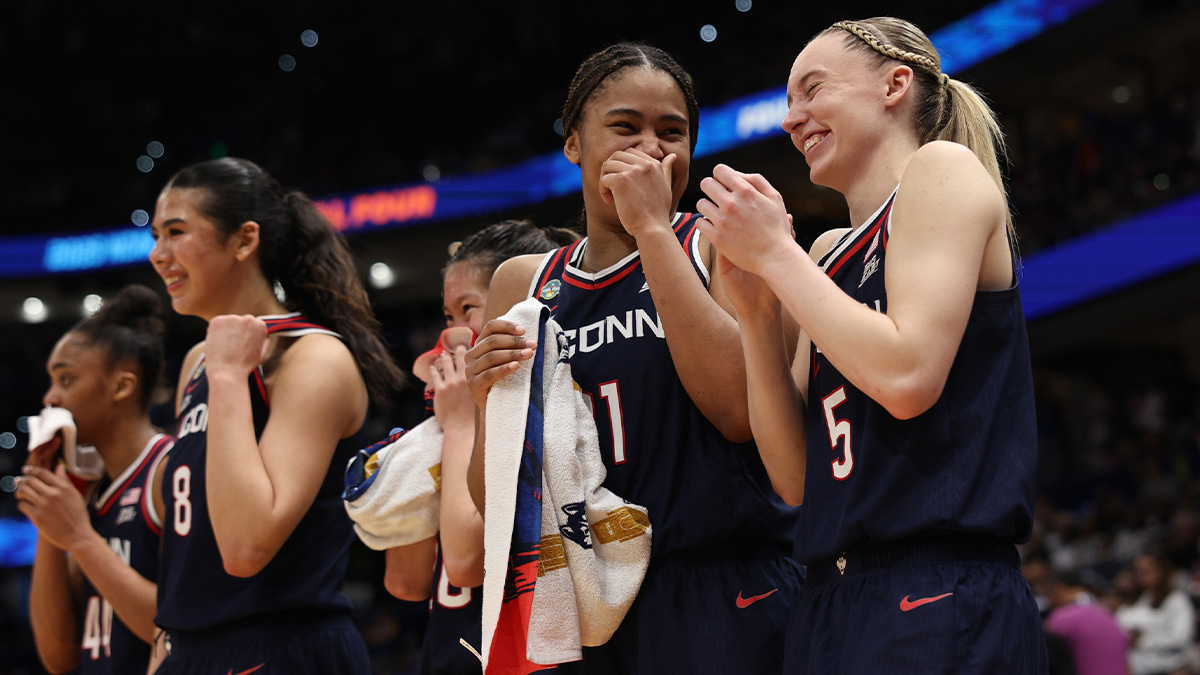 Connecticut Huskies forward Sarah Strong (21) and guard Paige Bueckers (5) react on the bench during the fourth quarter in a semifinal of the women's 2025 NCAA tournament against the UCLA Bruins at Amalie Arena.