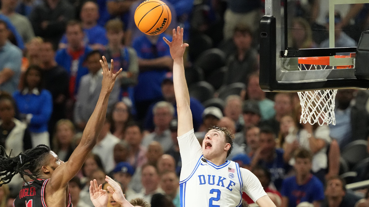 Duke Blue Devils forward Cooper Flagg (2) and Houston Cougars forward Joseph Tugler (11) battle for the ball in the semifinals of the men's Final Four of the 2025 NCAA Tournament at the Alamodome.