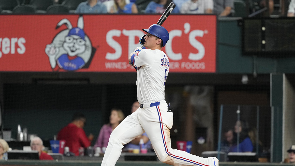 Texas Rangers shortstop Corey Seager (5) follows through for a solo home run against the Los Angeles Angels during the seventh inning at Globe Life Field. Seager’s home run was his 100th as a Texas Ranger.