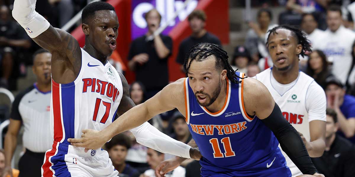 New York Knicks guard Jalen Brunson (11) dribbles defended by Detroit Pistons guard Dennis Schroder (17) in the first half during game three of first round for the 2024 NBA Playoffs at Little Caesars Arena.