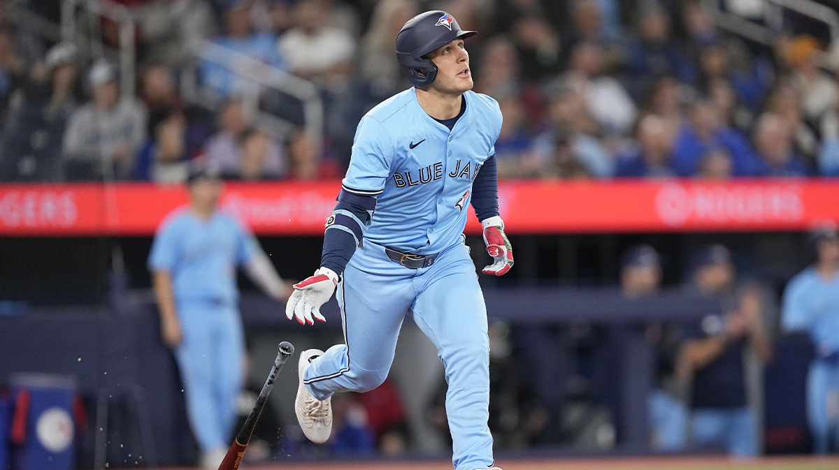 Toronto Blue Jays center fielder Dalton Varsho (5) runs to first base after hitting a two-run home run against the Boston Red Sox during the sixth inning at Rogers Centre.
