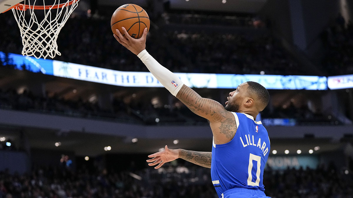 Milwaukee Bucks guard Damian Lillard (0) shoots during the third quarter against the Indiana Pacers at Fiserv Forum.