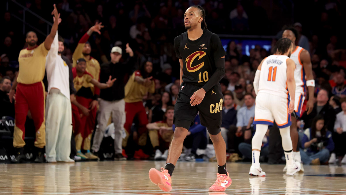 Cleveland Cavaliers guard Darius Garland (10) and the Cavalier bench react after his three point shot against the New York Knicks during the fourth quarter at Madison Square Garden.