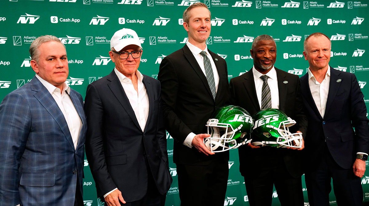 New York Jets President, Hymie Elhai, owner, Woody Johnson, general manager, Darren Mougey, head coach, Aaron Glenn and vice chairman, Christopher Johnson, pose for a photograph,