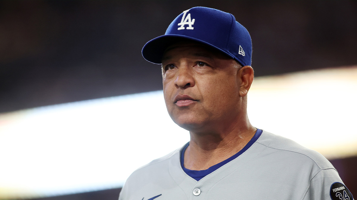 Los Angeles Dodgers manager Dave Roberts (30) walks back to the dugout before a game against the Texas Rangers at Globe Life Field.