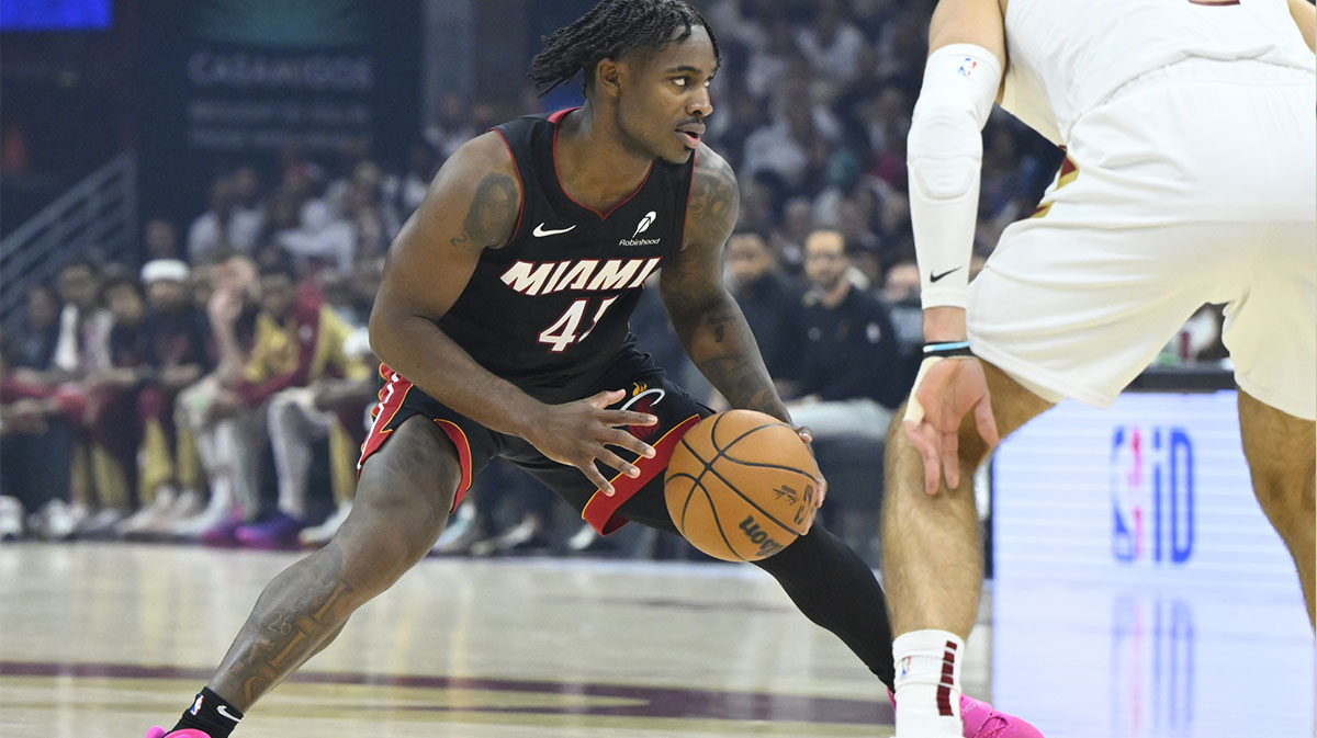 Miami Heat guard Davion Mitchell (45) dribbles beside Cleveland Cavaliers guard Max Strus (1) in the first quarter of game two of the first round of the 2025 NBA Playoffs at Rocket Arena.