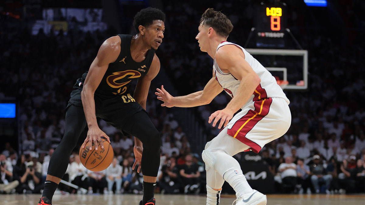Cleveland Cavaliers forward De'Andre Hunter (12) dribbles the basketball as Miami Heat guard Pelle Larsson (9) defends in the second quarter during game four for the first round of the 2025 NBA Playoffs at Kaseya Center.