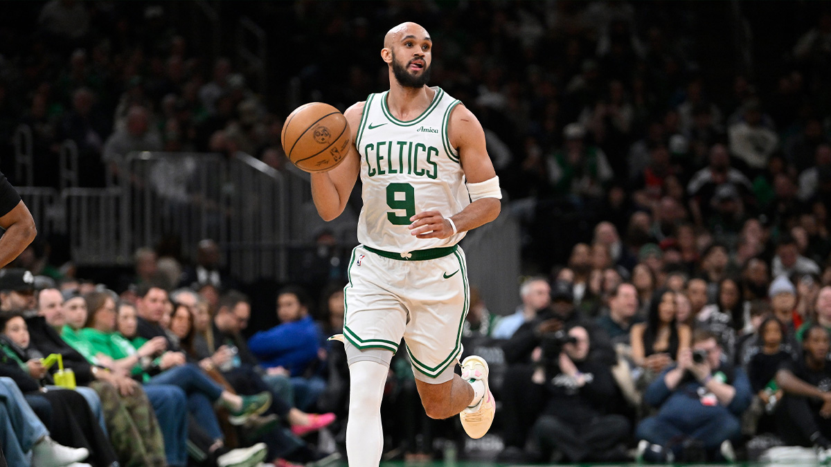 Boston Celtics guard Derrick White (9) dribbles the ball against the Charlotte Hornets during the first half at TD Garden.