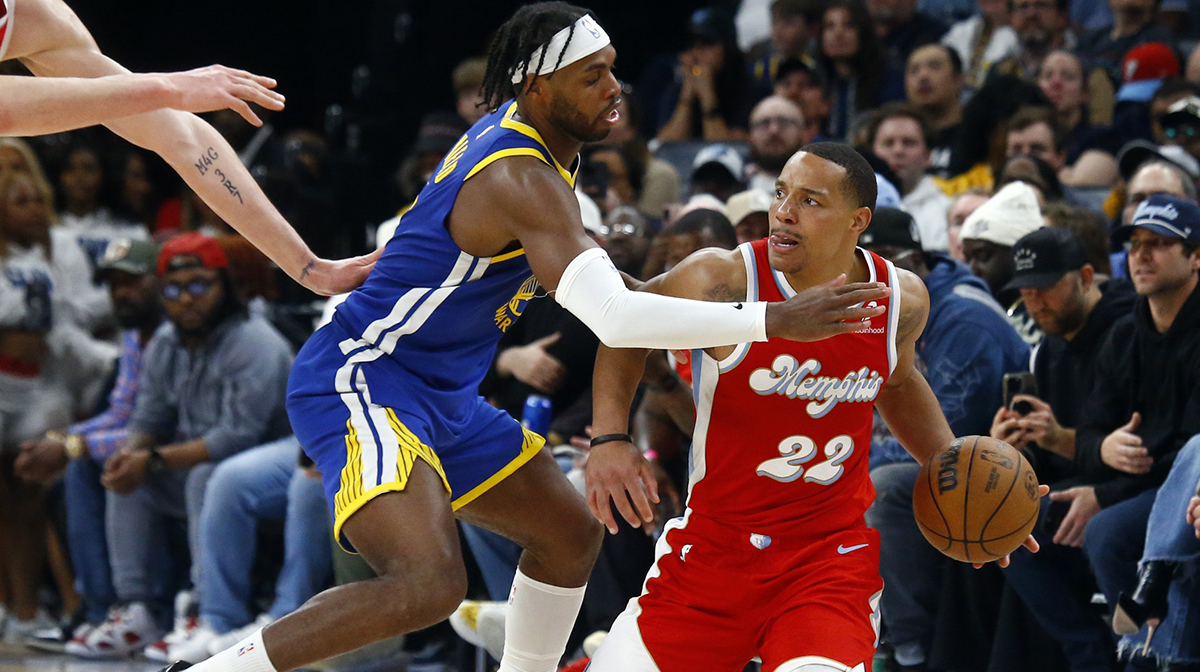Memphis Grizzlies guard Desmond Bane (22) handles the ball as Golden State Warriors guard Buddy Hield (7) defends during the fourth quarter at FedExForum.