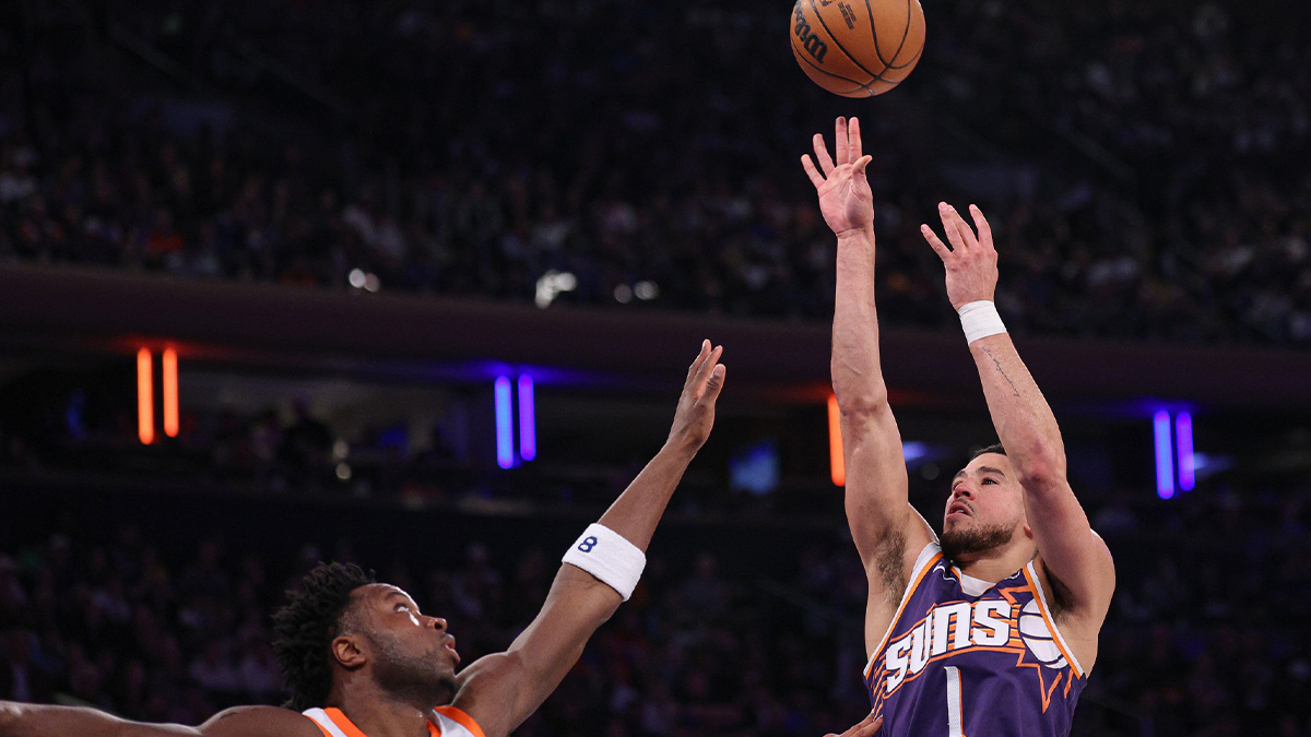 Phoenix Suns guard Devin Booker (1) shoots the ball against New York Knicks forward OG Anunoby (8) uring the first half at Madison Square Garden.
