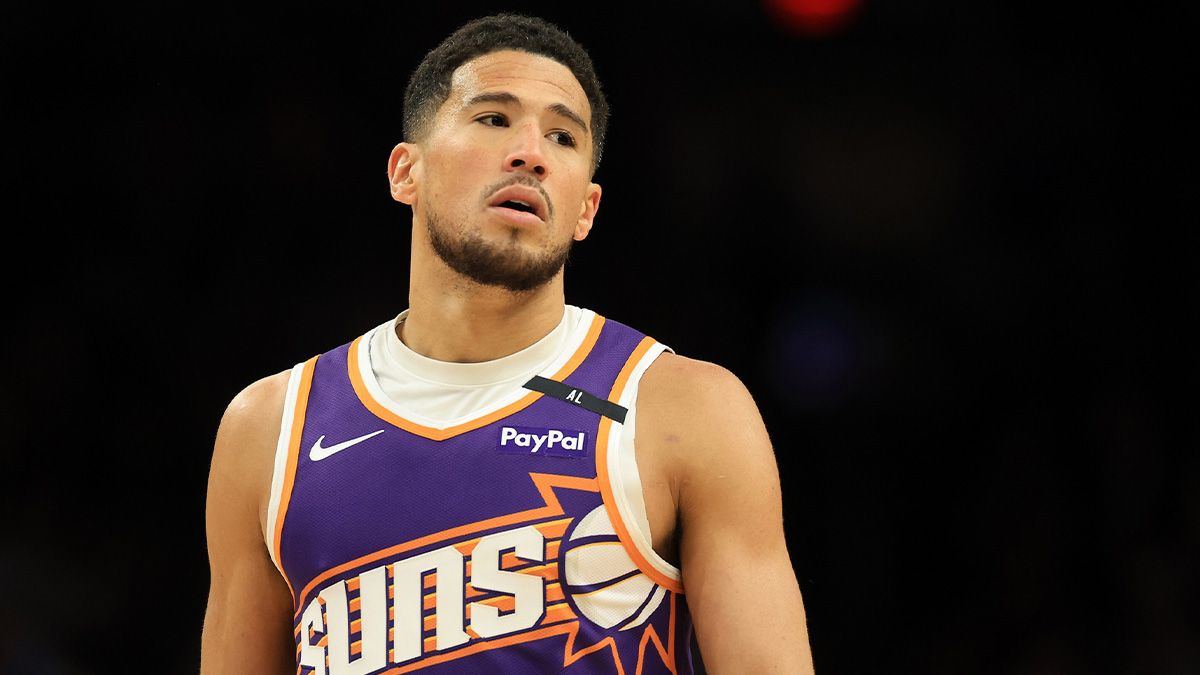 Phoenix Suns guard Devin Booker (1) reacts against the Golden State Warriors during the second half at Footprint Center.