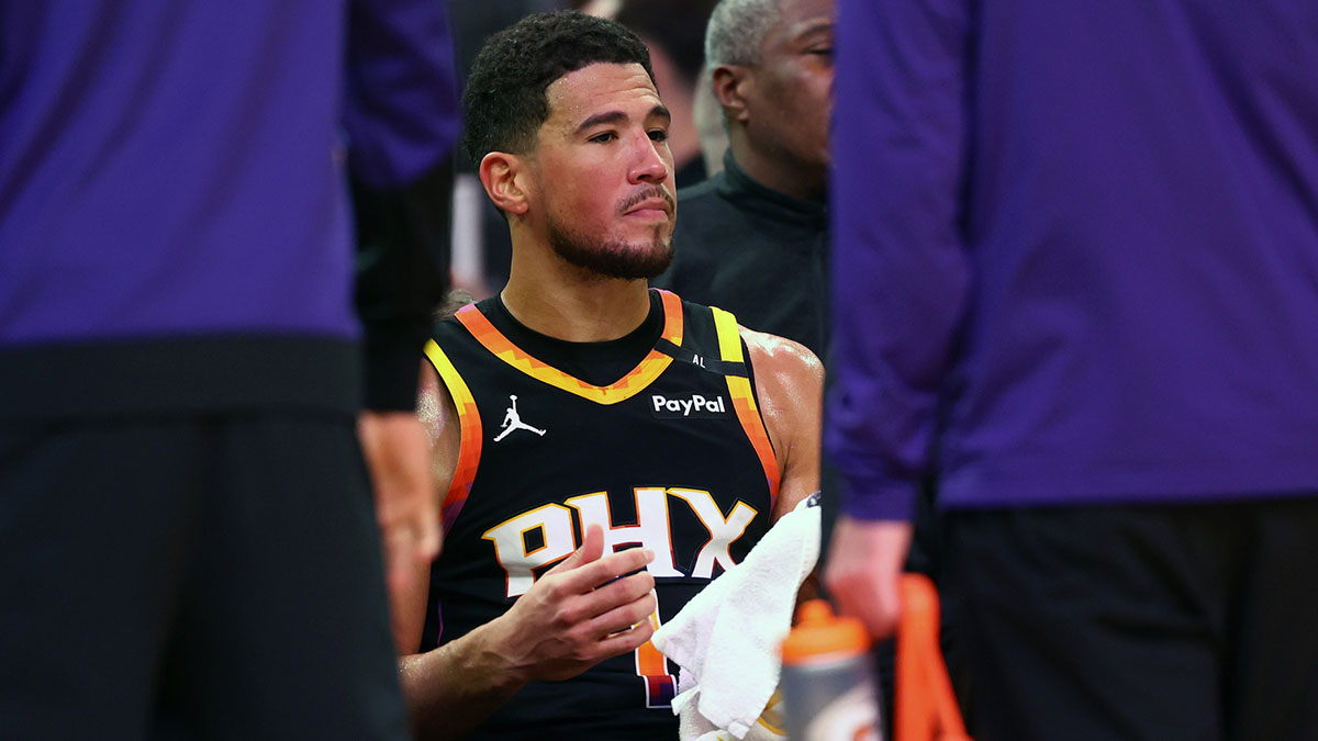 Phoenix Suns guard Devin Booker (1) reacts on the bench against the Oklahoma City Thunder during the second half at Footprint Center.