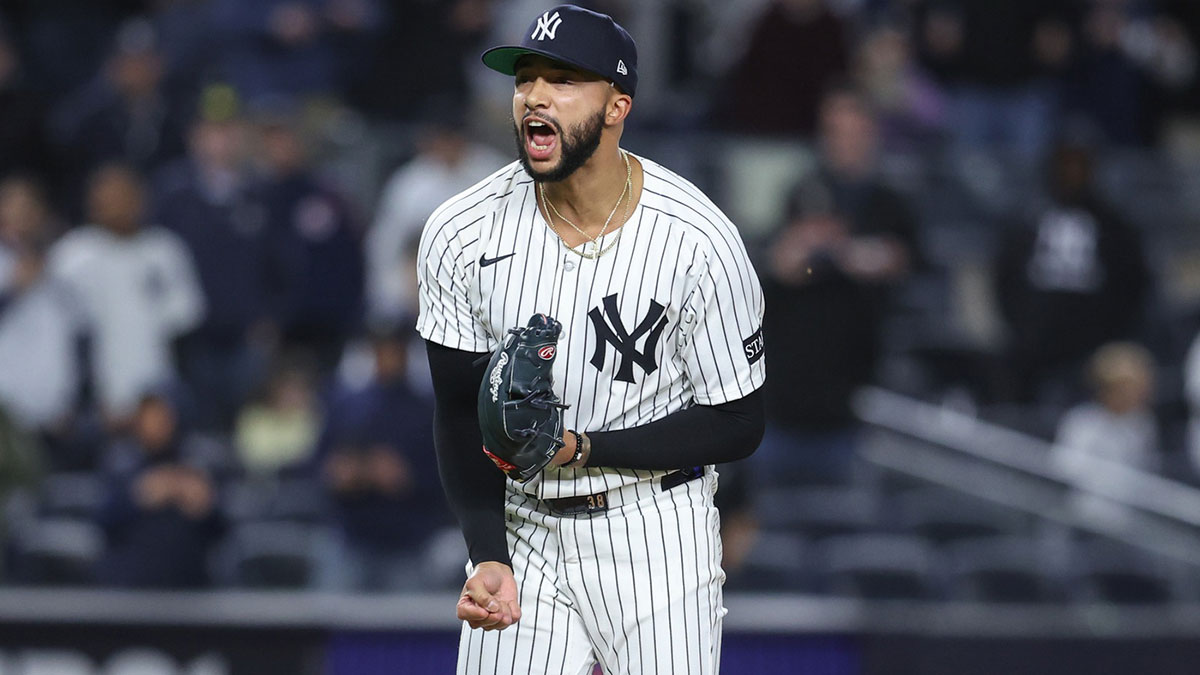 Apr 15, 2025; Bronx, New York, USA; New York Yankees relief pitcher Devin Williams (38) celebrates after recording a save in a 4-2 win against the Kansas City Royals at Yankee Stadium. All players wore #42 for Jackie Robinson Day. Mandatory Credit: Wendell Cruz-Imagn Images