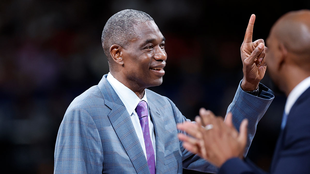 Dikembe Mutombo gestures as he is introduced after the first quarter at Saitama Super Arena.