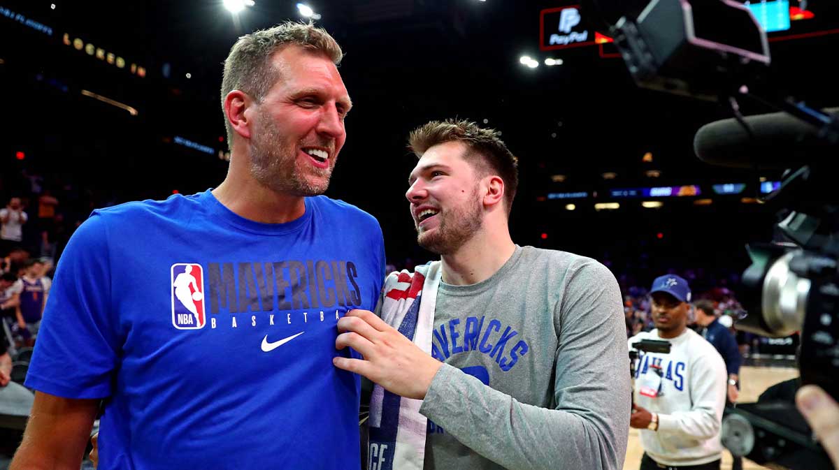 Dallas Mavericks guard Luka Doncic (77) greets former player Dirk Nowitzki after beating the Phoenix Suns in game seven of the second round for the 2022 NBA playoffs at Footprint Center.